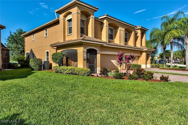 view of front of property with a garage and a front lawn