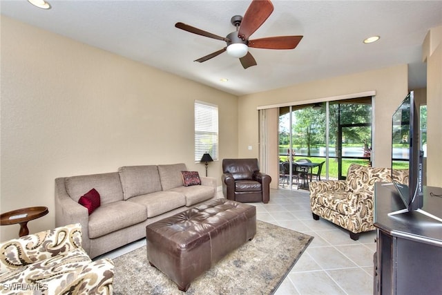 tiled living room featuring ceiling fan