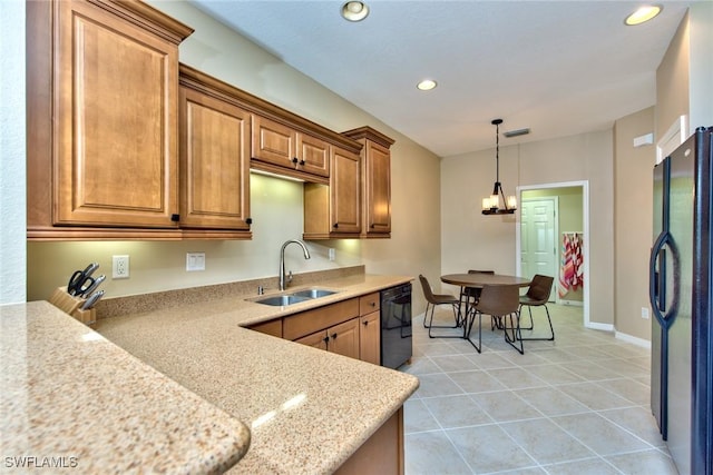 kitchen featuring sink, light tile patterned floors, hanging light fixtures, a chandelier, and black appliances