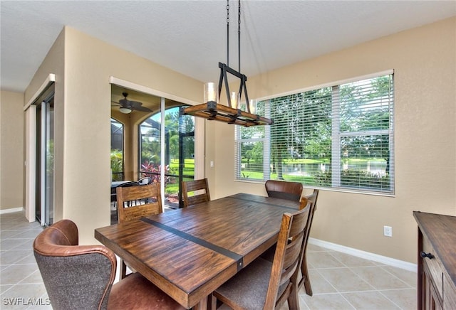 tiled dining area featuring ceiling fan