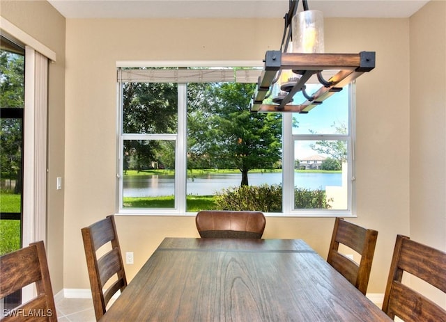 unfurnished dining area with a water view