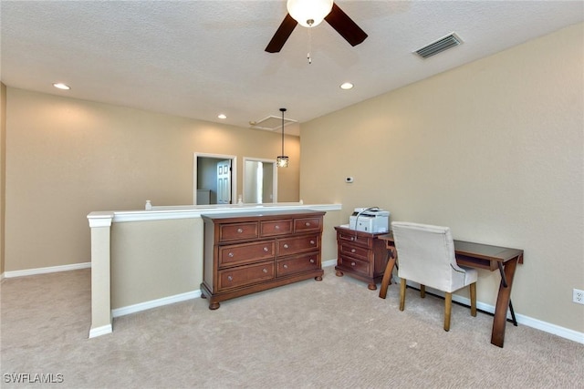 home office featuring ceiling fan and light colored carpet