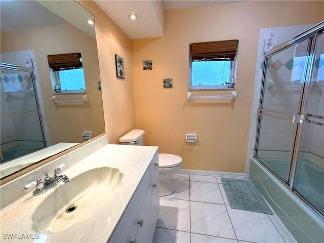 full bathroom featuring toilet, tile patterned flooring, vanity, and shower / bath combination with glass door