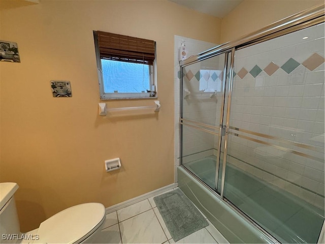 bathroom with toilet, bath / shower combo with glass door, and tile patterned flooring