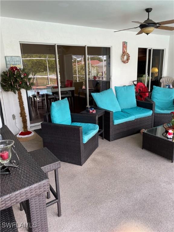 exterior space with ceiling fan and an outdoor hangout area