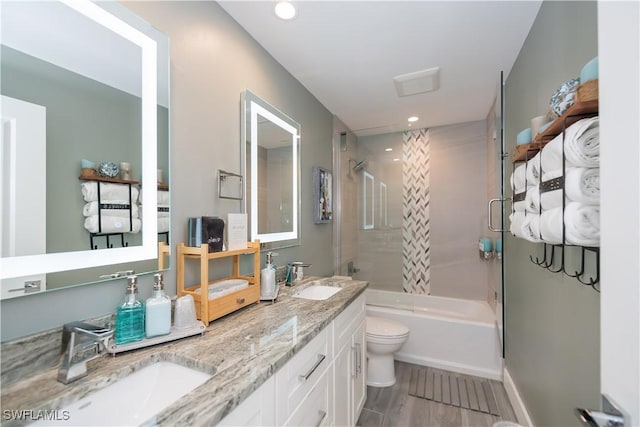 full bathroom with vanity, shower / bathing tub combination, wood-type flooring, and toilet