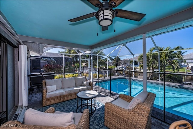 view of pool featuring an outdoor living space, a patio, and glass enclosure