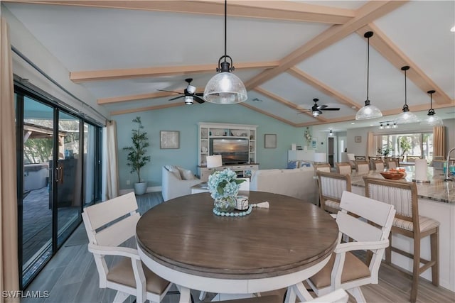 dining space with lofted ceiling with beams and ceiling fan