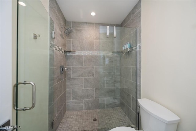 bathroom with walk in shower and toilet