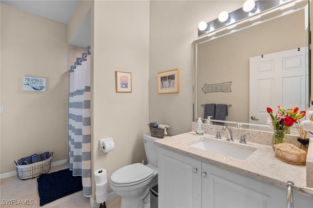 bathroom featuring tile patterned floors, vanity, toilet, and walk in shower