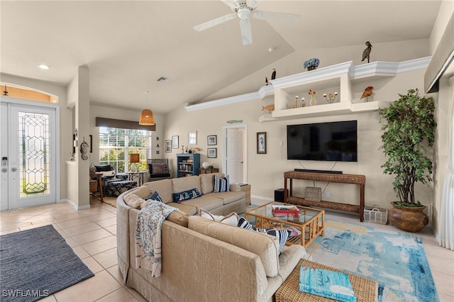 tiled living room with ceiling fan, french doors, and vaulted ceiling