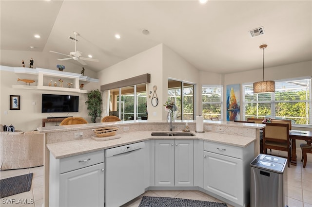 kitchen featuring white cabinetry, sink, white dishwasher, and lofted ceiling