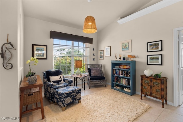 sitting room featuring light tile patterned floors and vaulted ceiling