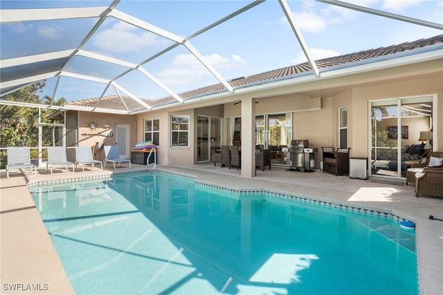 view of pool featuring a patio area and a lanai