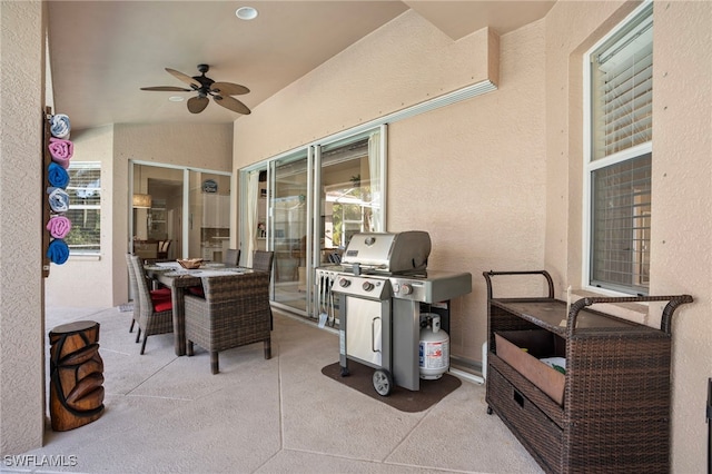 view of patio featuring area for grilling and ceiling fan