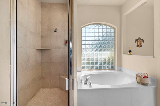 bathroom with separate shower and tub