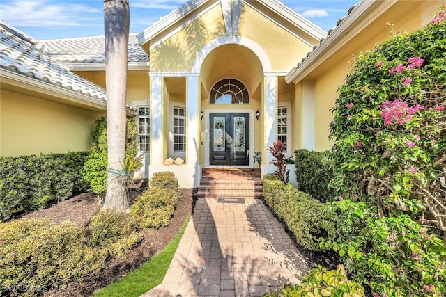 4200 Sanctuary Way, Bonita Springs, FL 34134 - property entrance featuring french doors and stucco siding