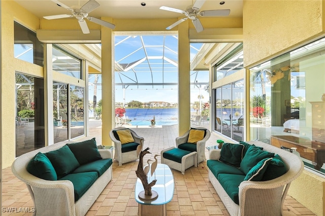 sunroom / solarium featuring ceiling fan