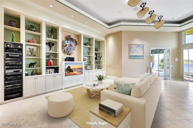 4200 Sanctuary Way, Bonita Springs, FL 34134 - living room featuring tile patterned floors, a raised ceiling, recessed lighting, and built in shelves