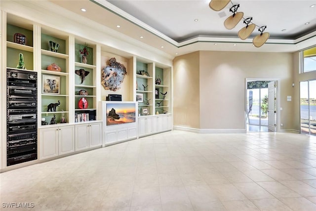 4200 Sanctuary Way, Bonita Springs, FL 34134 - unfurnished living room featuring a tray ceiling, built in shelves, recessed lighting, and tile patterned floors