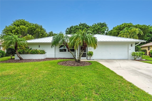 ranch-style house with a garage and a front yard