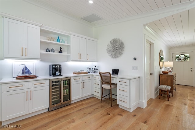 bar featuring white cabinetry, wine cooler, ornamental molding, wood ceiling, and light hardwood / wood-style floors