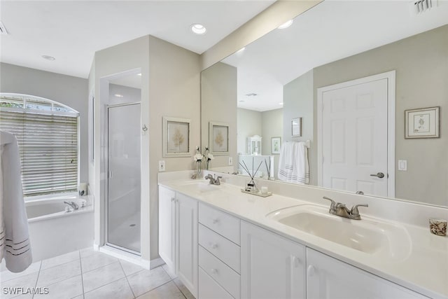 bathroom with separate shower and tub, vanity, and tile patterned flooring