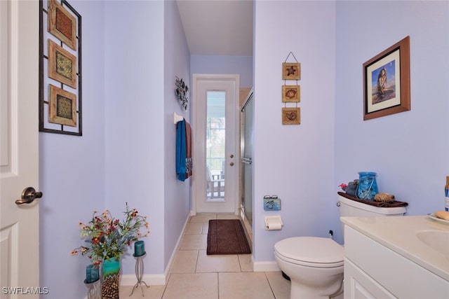 bathroom with a shower with shower door, plenty of natural light, and tile patterned floors