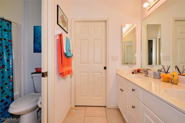 full bathroom with shower / bath combo with shower curtain, tile patterned floors, vanity, and toilet