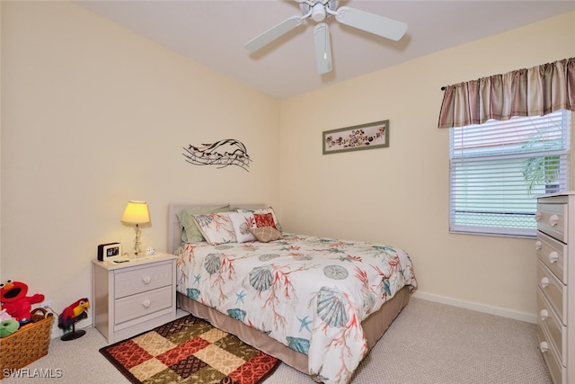 bedroom with ceiling fan and light colored carpet