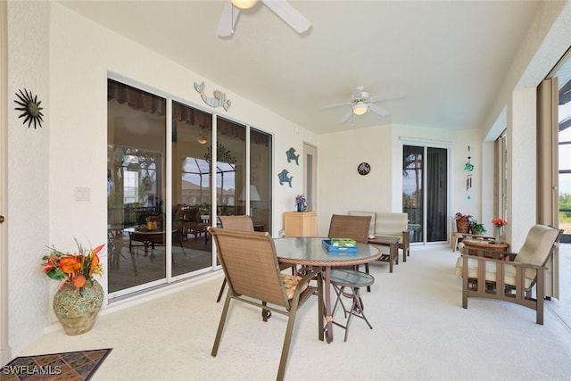 sunroom with ceiling fan