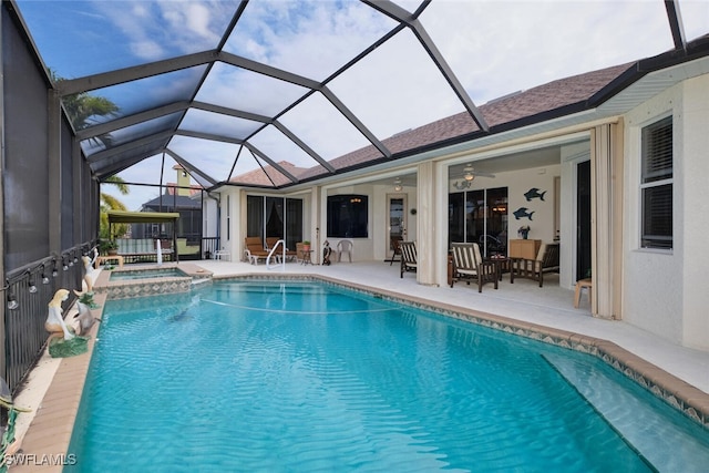 view of pool featuring ceiling fan, a lanai, an in ground hot tub, and a patio