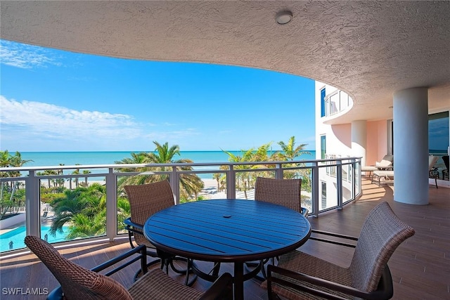 balcony featuring a water view