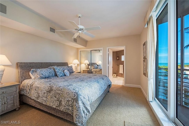 carpeted bedroom with ceiling fan, access to exterior, ensuite bathroom, and a closet