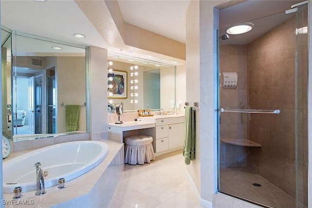 bathroom with tile patterned floors, separate shower and tub, and vanity