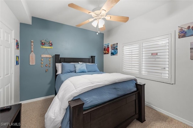 bedroom with ceiling fan and light colored carpet