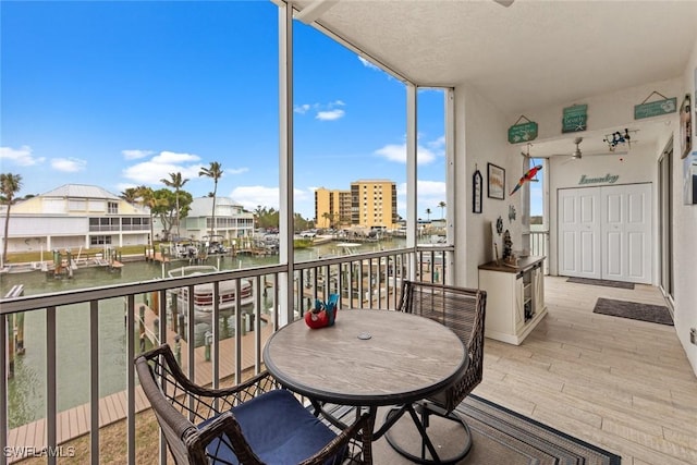 balcony featuring a water view