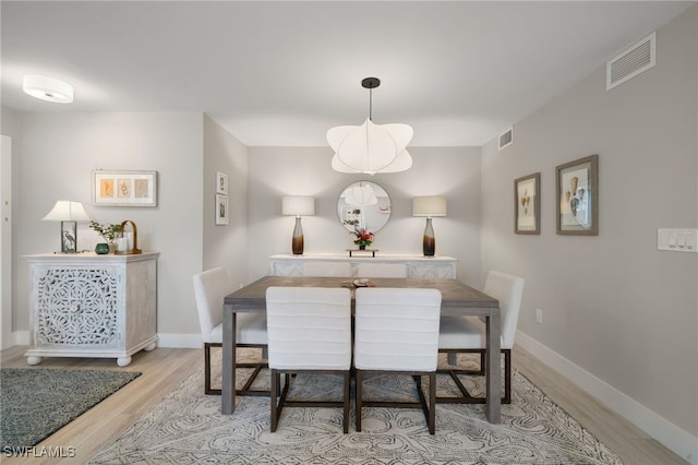 dining space featuring light hardwood / wood-style floors