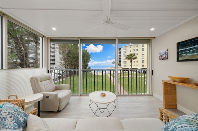 sunroom featuring ceiling fan