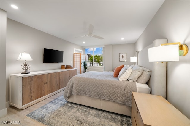 bedroom with light hardwood / wood-style floors and ceiling fan