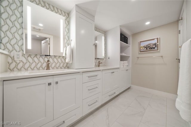 bathroom with vanity and backsplash