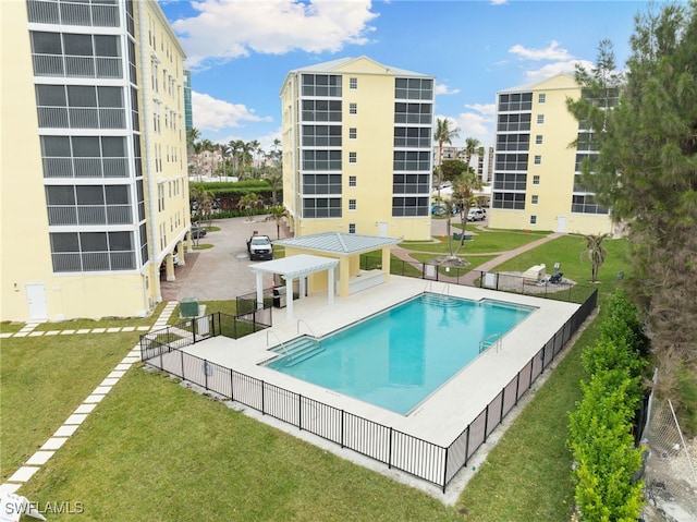 view of swimming pool with a yard, a pergola, and a patio area