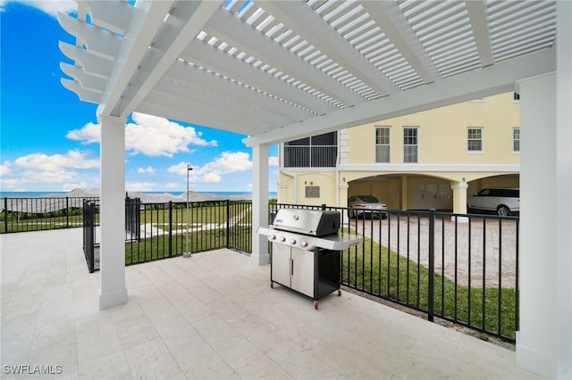 view of patio with a grill and a pergola