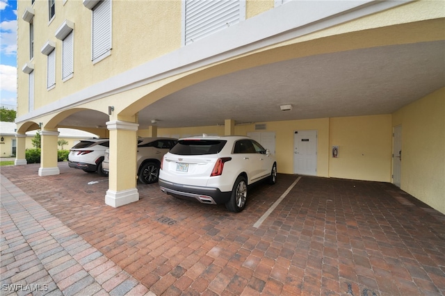 view of parking featuring a carport