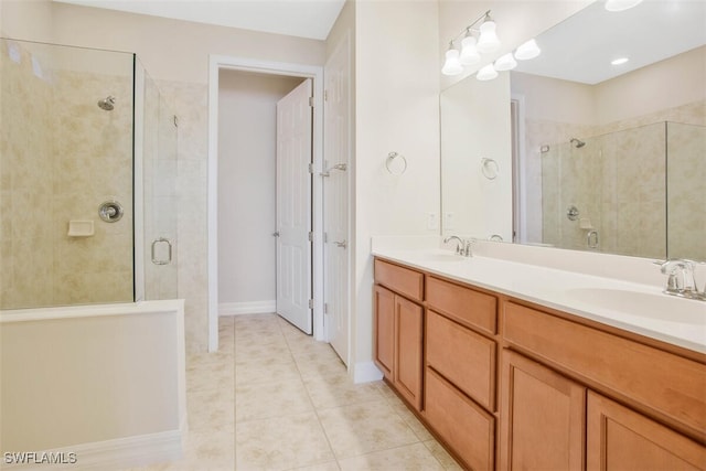 bathroom with vanity, tile patterned floors, and a shower with door