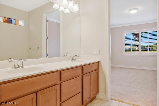 bathroom with ornamental molding, vanity, and tile patterned floors