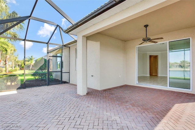 view of patio / terrace featuring a lanai and ceiling fan