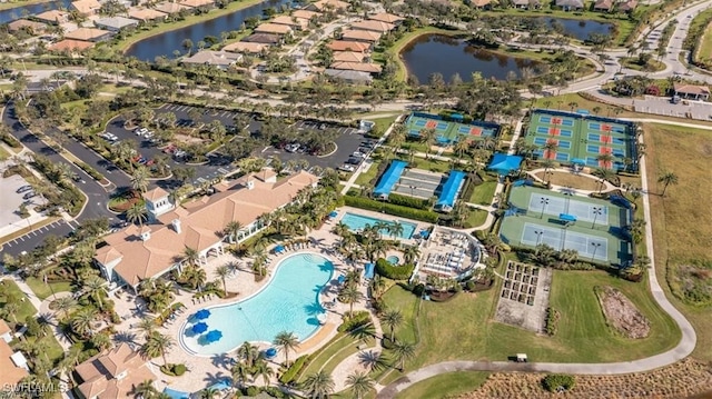 birds eye view of property with a water view