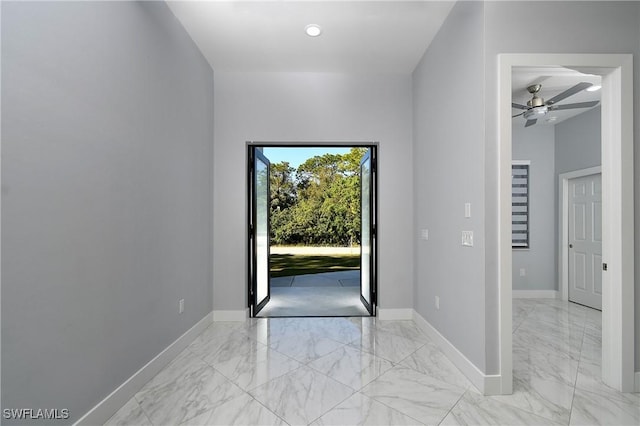 doorway to outside with ceiling fan