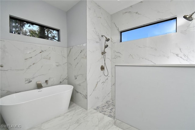 bathroom featuring separate shower and tub